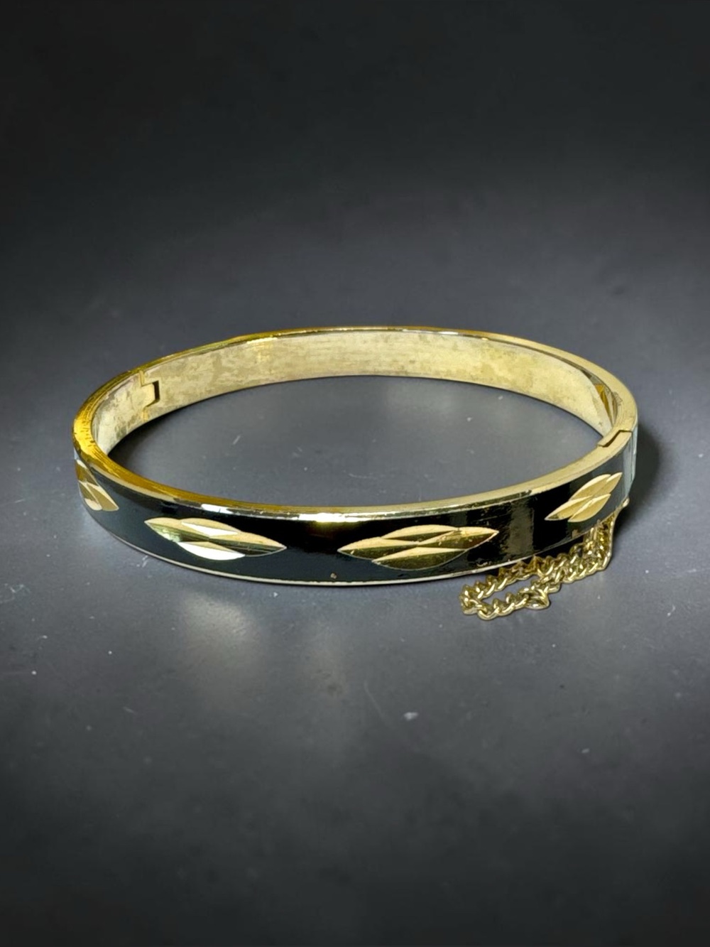 Elegant Vintage Gold and Black Enamel Hinged Bangle Bracelet with Safety chain